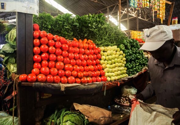 a_client_buy_vegetables_at_kimironko_market_._the_past_weeks_have_been_characterized_by_an_increase_in_commodity_prices_.craish_bahizi