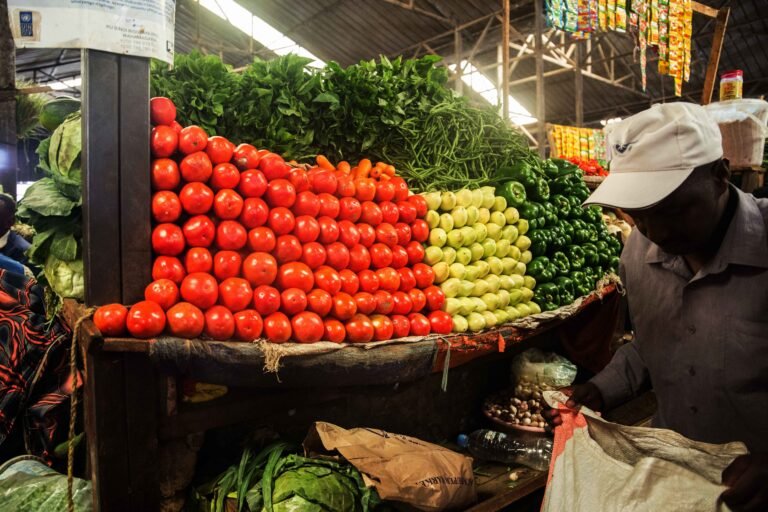 a_client_buy_vegetables_at_kimironko_market_._the_past_weeks_have_been_characterized_by_an_increase_in_commodity_prices_.craish_bahizi