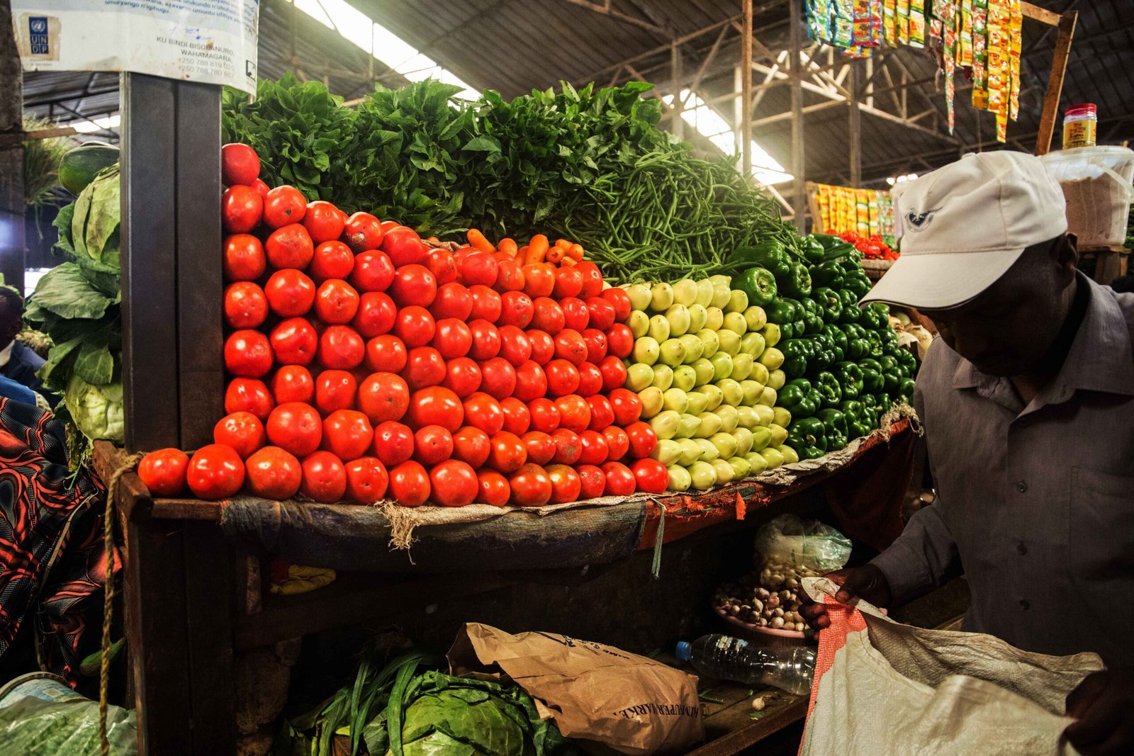 a_client_buy_vegetables_at_kimironko_market_._the_past_weeks_have_been_characterized_by_an_increase_in_commodity_prices_.craish_bahizi